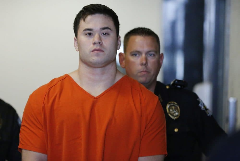 Daniel Holtzclaw, a former Oklahoma City police officer accused of sexually assaulting women he encountered while on patrol, is led into a courtroom for a hearing in Oklahoma City, Sept. 3, 2014. (Sue Ogrocki/AP)