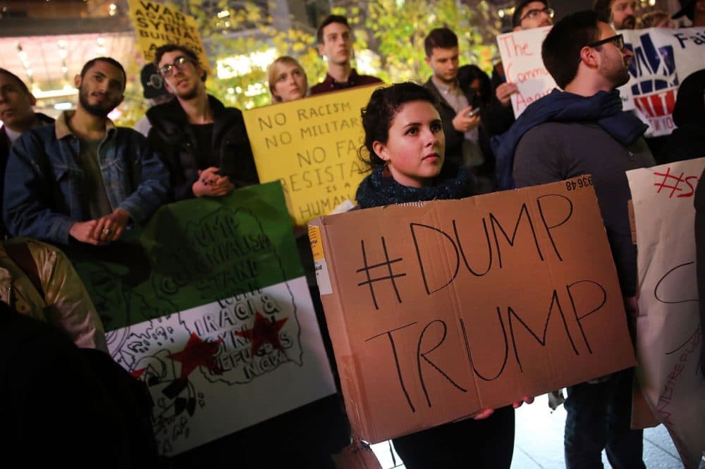 People listen to speakers at a demonstration against racism and Republican presidential candidate Donald Trump's recent remarks concerning Muslims on December 10, 2015 in New York City. Dozens of demonstrators and activists converged at Columbus Circle to denounce the politics of Trump and the treatment of Muslim refugees both in America and Europe.  (Spencer Platt/Getty Images)