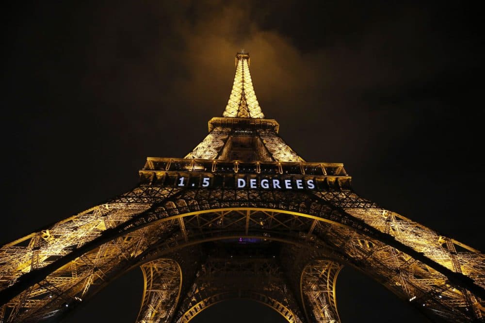 '1.5 Degrees' in white neon is lit on the Eiffel Tower in the French capital, as the COP21 United Nations Climate Change Conference took place at Le Bourget, on the outskirts of Paris. (Patrick Kovarik/AFP/Getty Images)