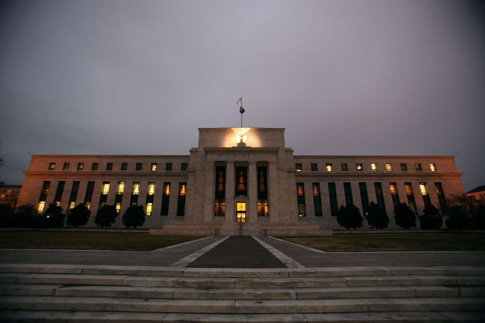 Flags fly over the Federal Reserve Building on Dec. 16, 2008, in Washington, D.C. The Fed is expected to announce today a raise in interest rates by a quarter of a percent. (Mark Wilson/Getty Images)