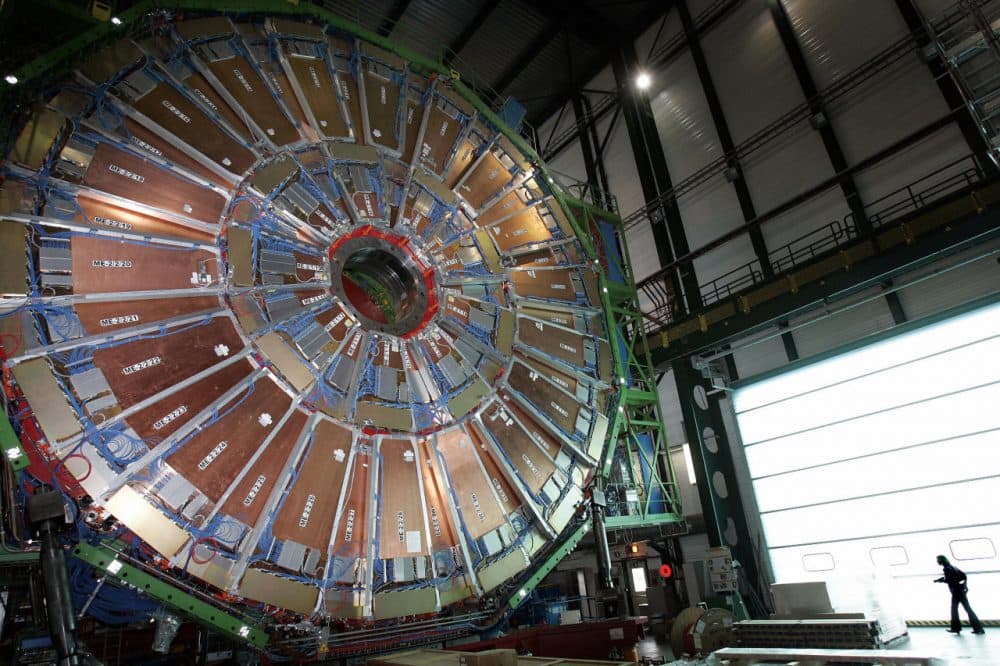 This file picture taken on March 22, 2007 shows a woman walking near the world's largest superconducting solenoid magnet (CMS), at the European Organization for Nuclear Research (CERN)'s Large Hadron Collider (LHC) particle accelerator in Geneva.  (Fabrice Coffrini/AFP/Getty Images)