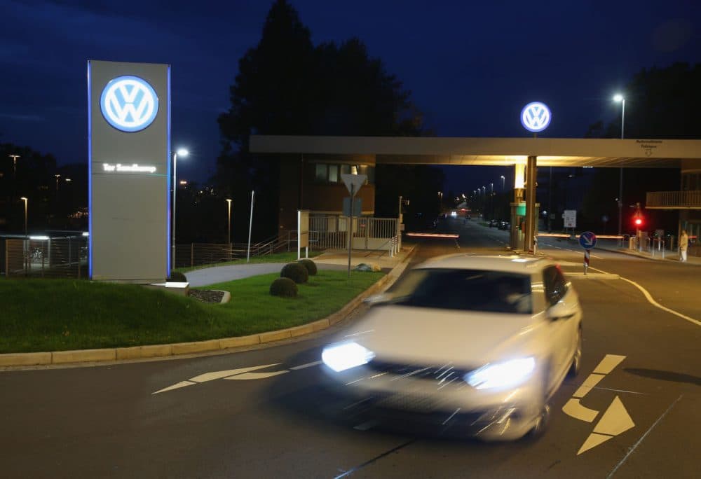 A car departs from an entrance gate at the Volkswagen factory and company headquarters on October 21, 2015 in Wolfsburg, Germany. (Sean Gallup/Getty Images)