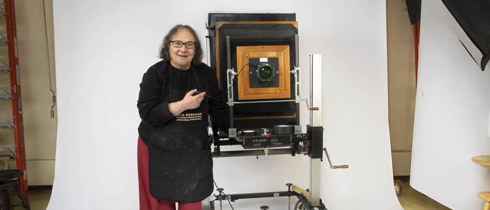 Photographer Elsa Dorfman with her 20x24 Polaroid camera in her studio. (Jesse Costa/WBUR)