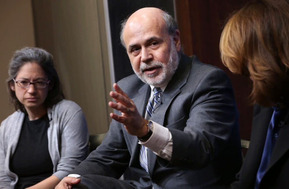 Former Fed Chairman Ben Bernanke (C) participates in a panel discussion at the Brookings Institution March 2 in Washington, DC. (Chip Somodevilla/Getty Images)