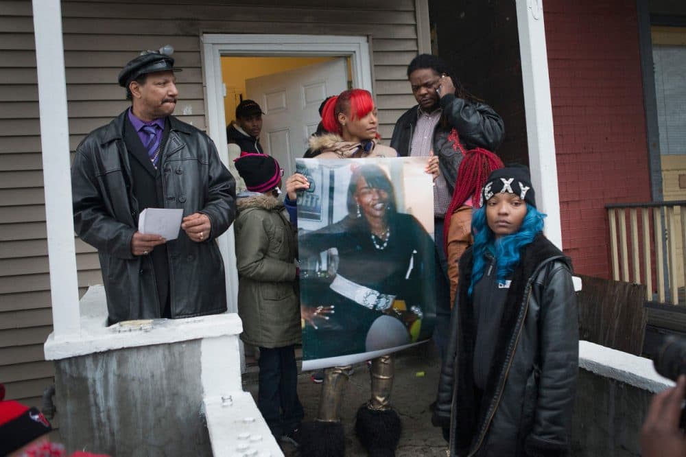 LaTonya Jones, the daughter of Bettie Jones, holds a picture of her mother during a vigil outside her home on December 27 in Chicago, Illinois. Bettie Jones was shot and killed yesterday at the front door of her home by police responding to a domestic dispute call made by her upstairs neighbor. (Scott Olson/Getty Images)