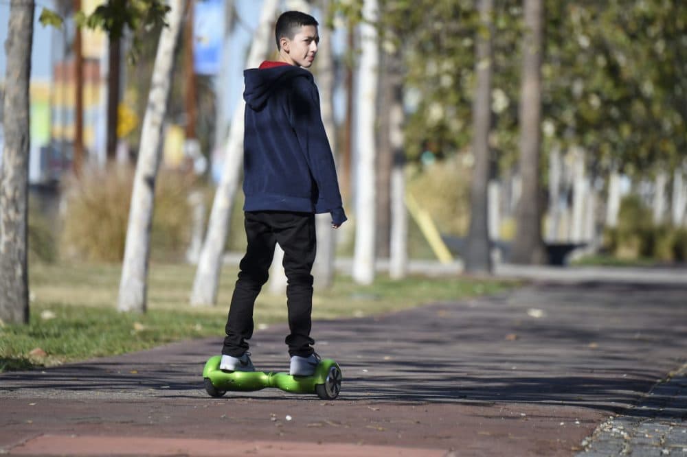 A boy rides a hoverboard on the day after Christmas in San Pedro, California. Reports of some hoverboards, also known as self-balancing, two-wheeled scooters catching fire have led to an investigation by the Consumer Product Safety Commission. (Robyn Beck/AFP/Getty Images)