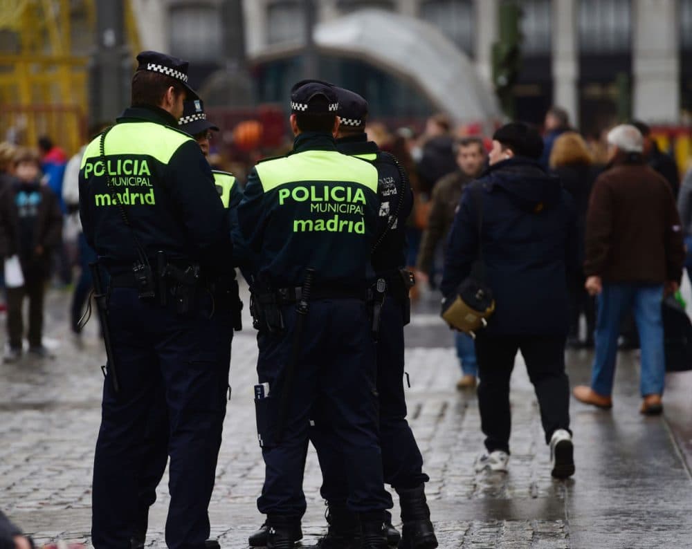 Spanish policemen patrol at Puerta del Sol square in the centre of Madrid, on December 31, 2015. Madrid City Council has set up today unprecedented security arrangements for the New Year's Eve, for the first time limiting the influx to the Puerta del Sol, where thousands of people come to swallow twelve grapes at the stroke of midnight. (Pierre-Philippe Marcou/AFP/Getty Images)