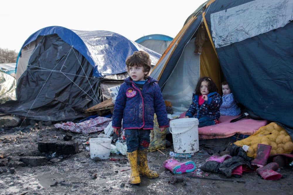 Children of Kurdish migrants gather outside a tent at the Grande Synthe migrant camp near Dunkerque in northern France on December 23, 2015.
More than 2,000 migrants, mostly Iraqis and Kurds, live in the camp. (Denis Charlet/AFP/Getty Images)