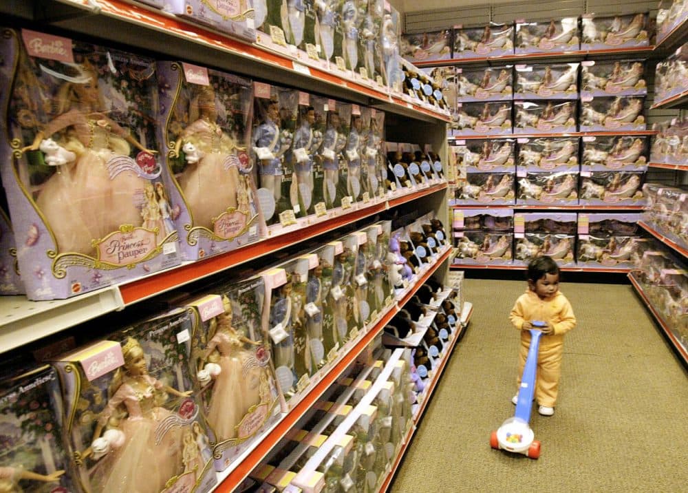Rebeca Ramirez pushes a toy along aisles filled with Barbie dolls at the Mattel Outlet Store, Monday, Jan. 31, 2005, in El Segundo, Calif. Worldwide sales of Mattel's flagship Barbie doll brand were down 1 percent during the fourth quarter, while sales of the company's Other Girls brand rose 1 percent during the same period. (AP Photo/Nick Ut)
