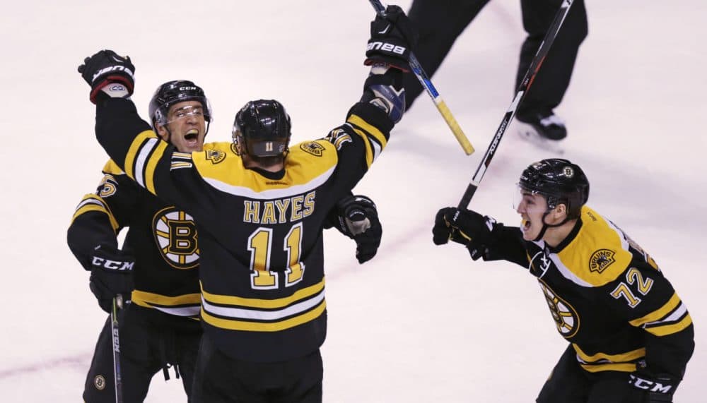 Boston Bruins right wing Jimmy Hayes (11) is congratulated after his third goal of the game by teammates Max Talbot and Frank Vatrano (72) during the third period of Tuesday night's game against the Ottawa Senators. (Charles Krupa/AP)