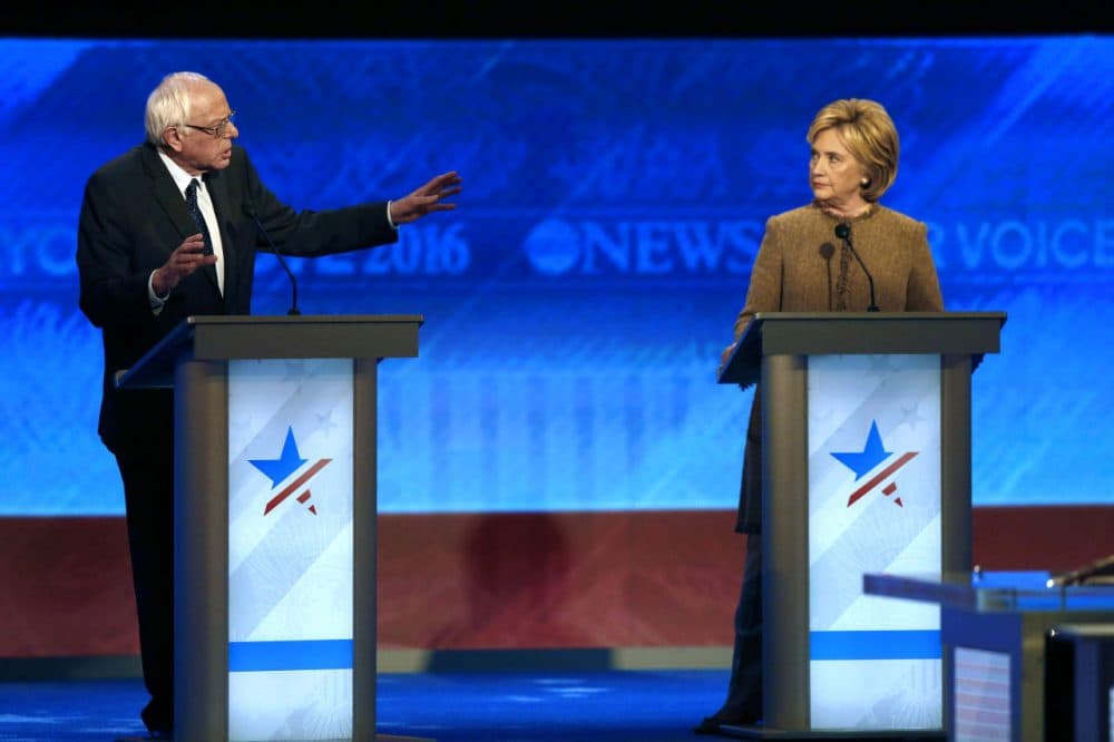 Bernie Sanders speaks to Hillary Clinton during a Democratic presidential primary debate on Saturday in Manchester, N.H. (Jim Cole/AP)