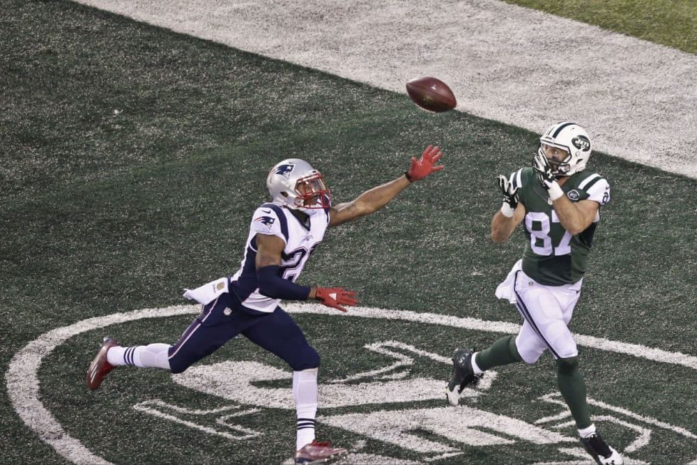 Wide receiver Eric Decker  caught a touchdown pass to put the New York Jets ahead 26-20 over the New England Patriots in overtime. (Peter Morgan/AP)