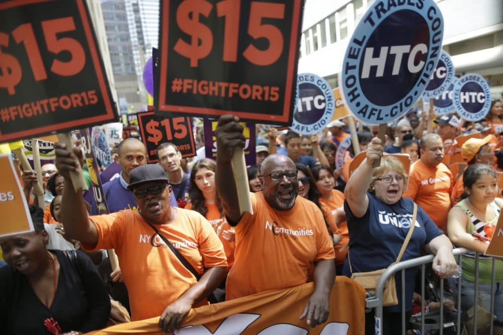 Activists cheered in July after the New York Wage Board endorsed a proposal to set a $15 minimum wage for workers at fast-food restaurants with 30 or more locations in New York. (Mary Altaffer/AP)