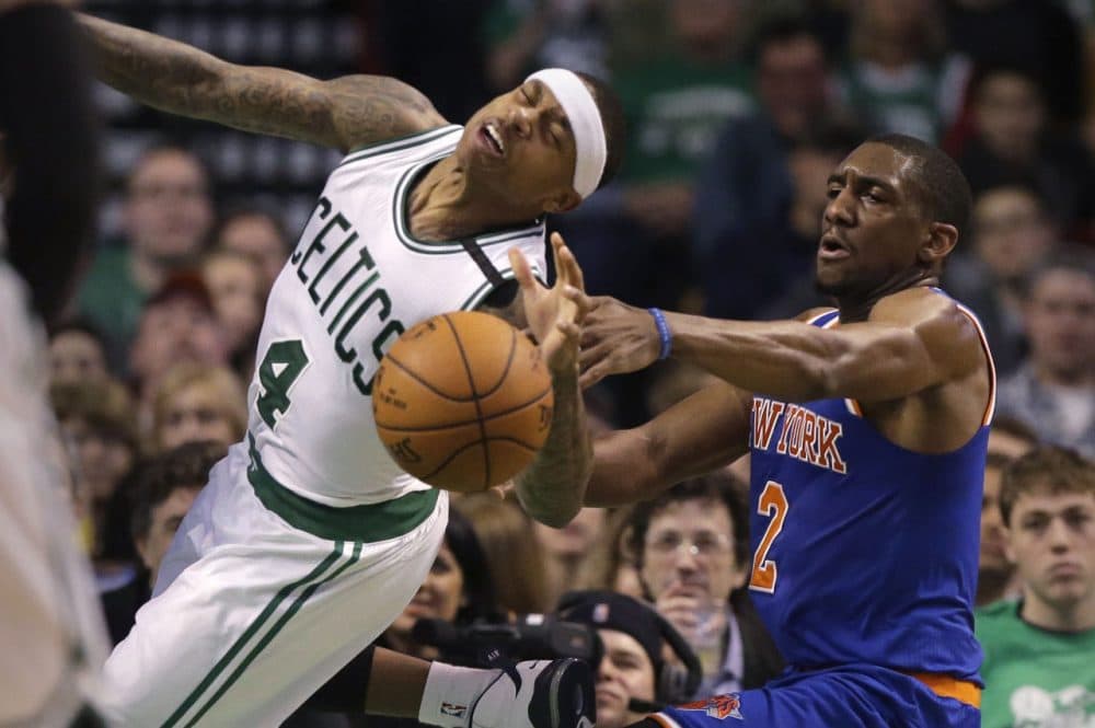 Boston Celtics guard Isaiah Thomas, left, tries to drive to the basket past New York Knicks guard Langston Galloway, right, during the fourth quarter of a game Sunday in Boston. (Steven Senne/AP)