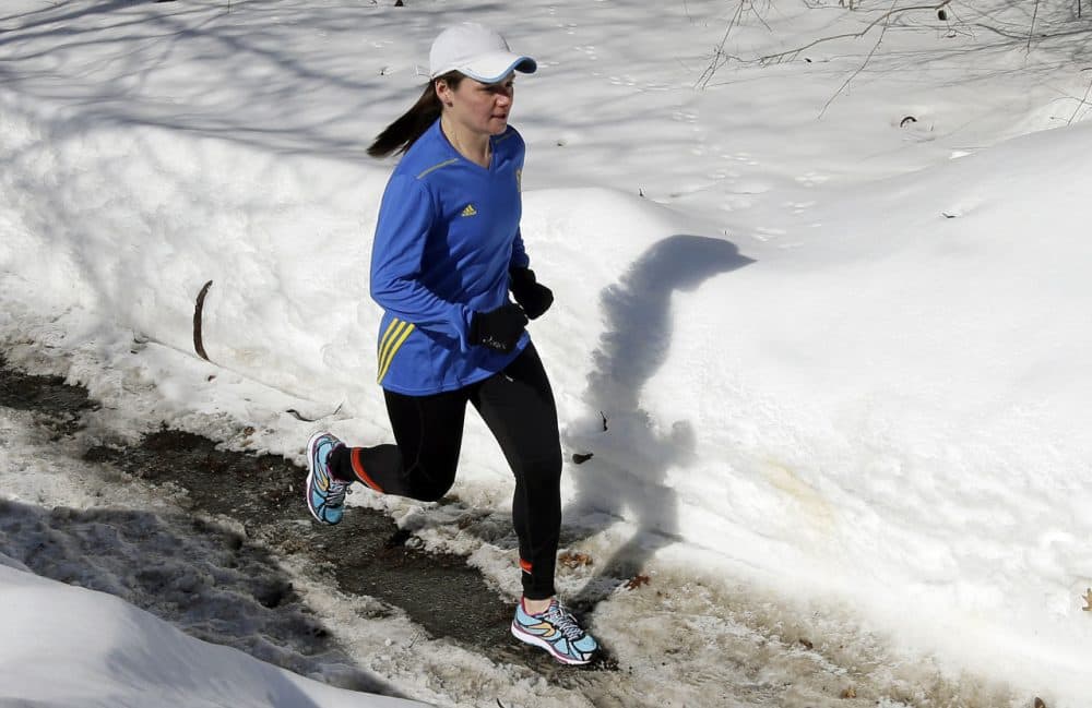 In this Feb. 27, 2015 photo, Becca Pizzi trains for the Boston Marathon along Heartbreak Hill in Newton, Mass. Pizzi, a veteran of 45 marathons, vies to be the first American woman to complete the World Marathon Challenge -- seven marathons in seven days on seven continents -- in January 2016.  (AP Photo/Elise Amendola)