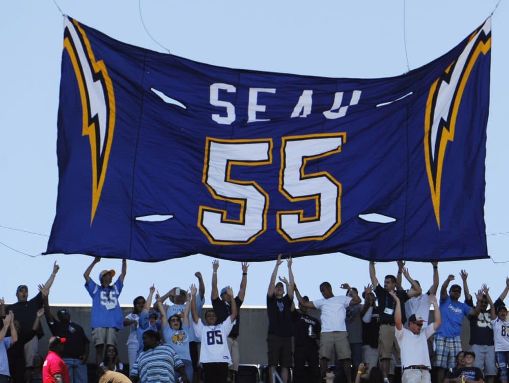 The number 55 jersey of former San Diego Chargers linebacker Junior Seau is retired before facing the  Tennessee Titans in an NFL football game Sunday, Sept. 16, 2012, in San Diego. The Chargers retired the number 55 jersey worn by Junior Seau, who committed suicide May 2, during a pre-game ceremony. (AP Photo/Denis Poroy)