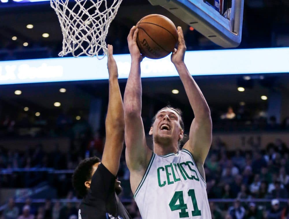 Boston Celtics center Kelly Olynyk drives to the basket against Minnesota Timberwolves center Karl-Anthony Towns (32) during Monday's game. Olynyk scored 19 points as the Celtics defeated the Timberwolves 113-99. (Charles Krupa/AP)