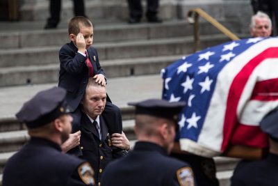 Ryan Lemm, age four, the son of New York Police Department (NYPD) Detective and Air National Guard Sergeant Joseph Lemm, salutes while his father's casket is brought out of St. Patrick's Cathedral after his father's funeral on December 30, 2015 in New York City. Lemm was killed on his third tour of duty in Afghanistan on December 21. (Andrew Burton/Getty Images)