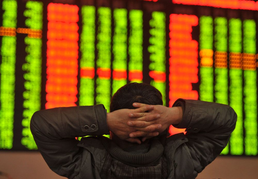 An investor sits in front of a screen showing stock market movements in a stock firm in Fuyang, east China's Anhui province on January 4, 2016. Trading on the Shanghai and Shenzhen stock exchanges was ended early on January 4 after shares fell seven percent, the first time China's new &quot;circuit breaker&quot; intervened to curb market volatility. (STR/AFP/Getty Images)