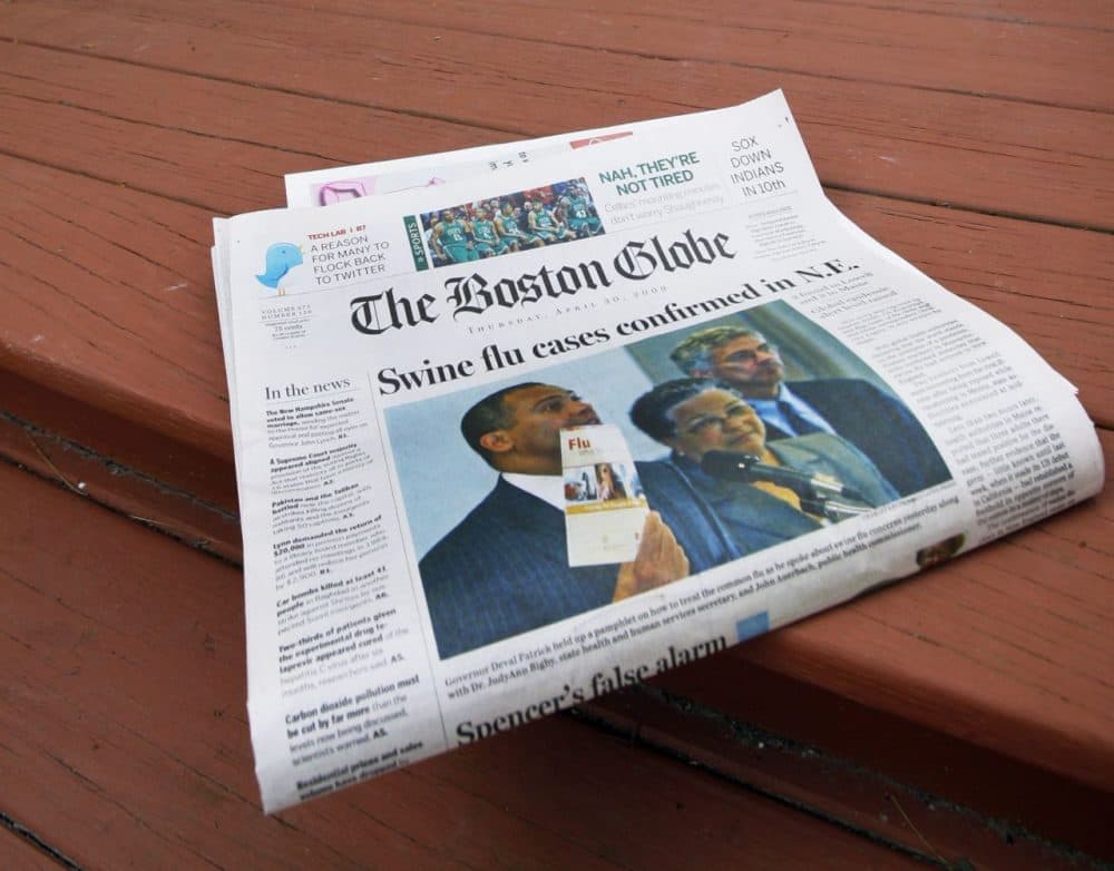 The Boston Globe after a home delivery in North Andover, Mass. in 2009. (Elise Amendola/AP)