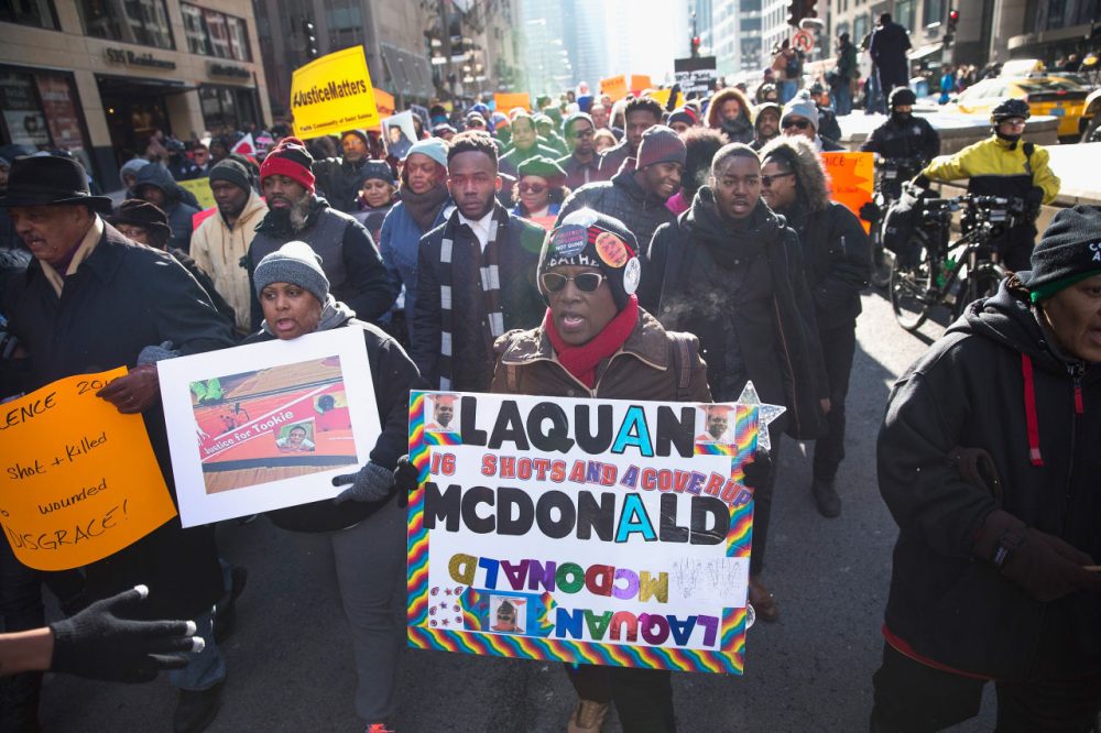 Demonstrators calling for an end to gun violence and the resignation of Chicago Mayor Rahm Emanuel march through downtown on December 31, 2015 in Chicago, Illinois. The shooting deaths by police of a 19-year-old college student Quintonio LeGrier and his 55-year-old neighbor Bettie Jones and a recently released video showing the shooting of 17-year-old Laquan McDonald by Chicago Police officer Jason Van Dyke have sparked dozens of protests in the city. Yesterday Emanuel announced several changes that would take place in the police department with the hope of preventing future incidents. (Scott Olson/Getty Images)