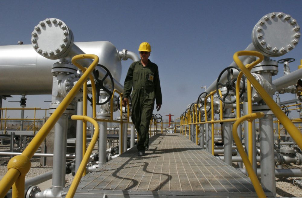 In this  April 15, 2008 photo, Iranian oil technician Majid Afshari makes his way at the oil separator facilities in Azadegan oil field, near Ahvaz, Iran. Iran is OPEC's second-largest producer. (Vahid Salemi/AP)