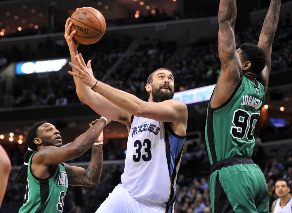 Grizzlies center Marc Gasol shoots between Celtics forwards Jae Crowder, left, and Amir Johnson in the first half of a game Sunday, in Memphis, Tenn. (Brandon Dill/AP)