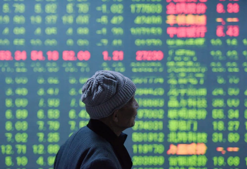 An investor looks at a screen showing stock market movements at a securities firm in Hangzhou, in eastern China's Zhejiang province on January 11, 2016. China's benchmark Shanghai stock index closed down 5.33 percent on January 11, as investors continued to worry over the state of the world's second largest economy, dealers said. (STR/AFP/Getty Images)
