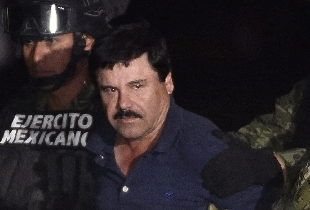 Drug kingpin Joaquin &quot;El Chapo&quot; Guzman is escorted into a helicopter at Mexico City's airport on January 8, 2016 following his recapture during an intense military operation in Los Mochis, in Sinaloa State. Mexican marines recaptured fugitive drug kingpin Joaquin &quot;El Chapo&quot; Guzman on Friday in the northwest of the country, six months after his spectacular prison break embarrassed authorities. (Omar Torres/AFP/Getty Images)