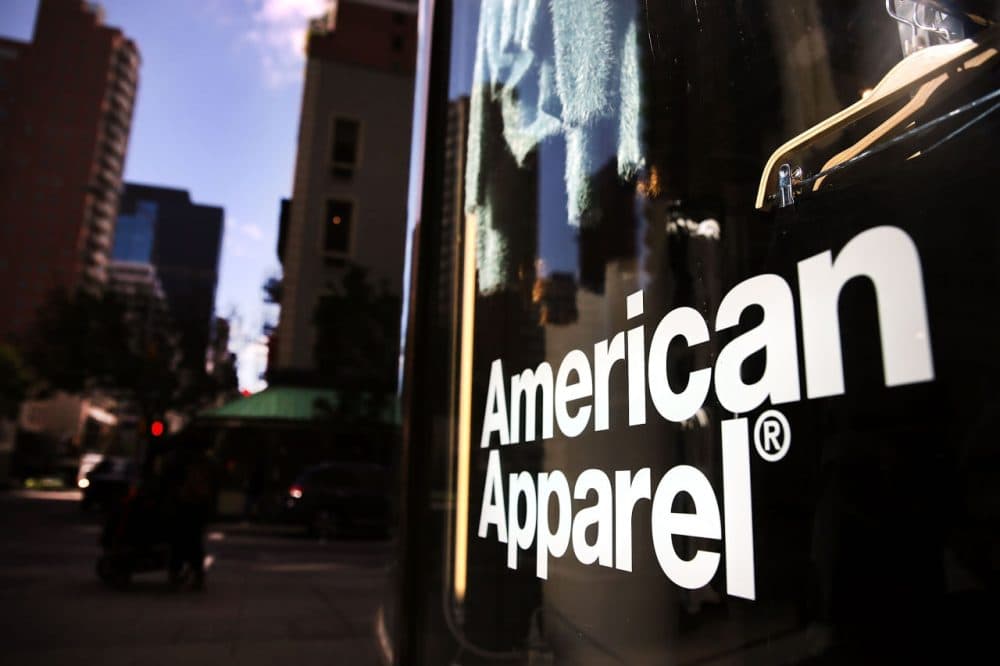The  American Apparel store logo is displayed in a window of a store on October 5, 2015 in New York City. American Apparel has filed for Chapter 11 bankruptcy protection nearly a year after the ousting of founder and CEO Dov Charney. In its latest quarter, the youth driven clothing company reported a loss of $19.4 million.  (Spencer Platt/Getty Images)