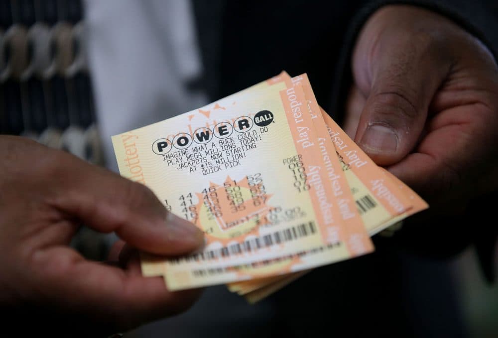 A customer holds Powerball tickets that he purchased at Kavanagh Liquors on January 12, 2015 in San Lorenzo, California. Dozens of people lined up outside of Kavanagh Liquors, a store that has had several multimillion-dollar winners, to purchase Powerball tickets in hopes of winning the estimated record-breaking $1.5 billion jackpot. (Justin Sullivan/Getty Images)