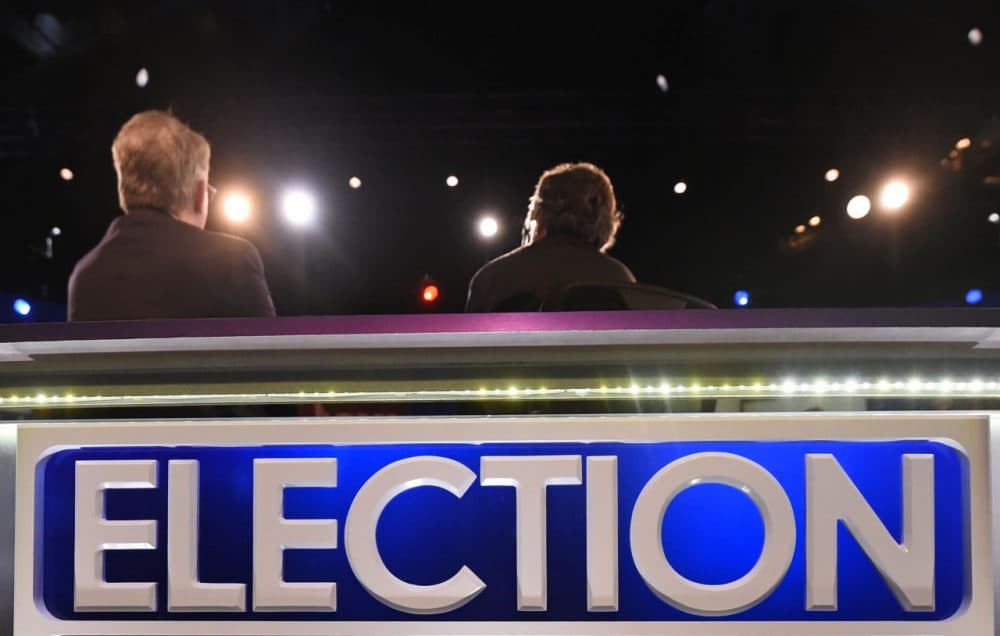 Dave Pregosin, right, lead stage manager, and Jeff Hark, left, director of production, sit in for moderators at the North Charleston Coliseum, Wednesday, Jan. 13, 2016, in North Charleston, S.C., in advance of Thursday's Fox Business Network Republican presidential debate. (Rainier Ehrhardt/AP)