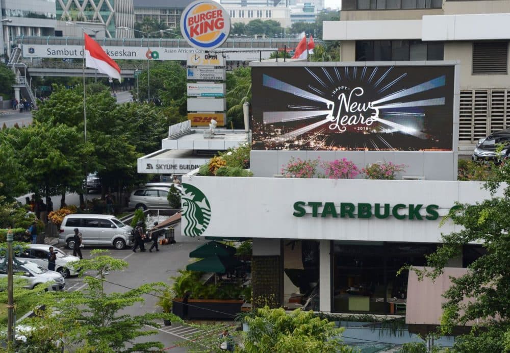 Indonesian police secure the area outside a damaged Starbucks coffee shop after a series of explosions hit central Jakarta on January 14, 2016. Gunfire and explosions in the Indonesian capital Jakarta killed at least four people on January 14 in what the country's president dubbed 'acts of terror', with fears that militants were still on the run. Starbucks announced in a statement that the company was closing all of its Jakarta branches 'until further notice' after one of its stores in the Indonesian capital was hit by apparent suicide attacks. (Romeo Gacad/AFP/Getty Images)