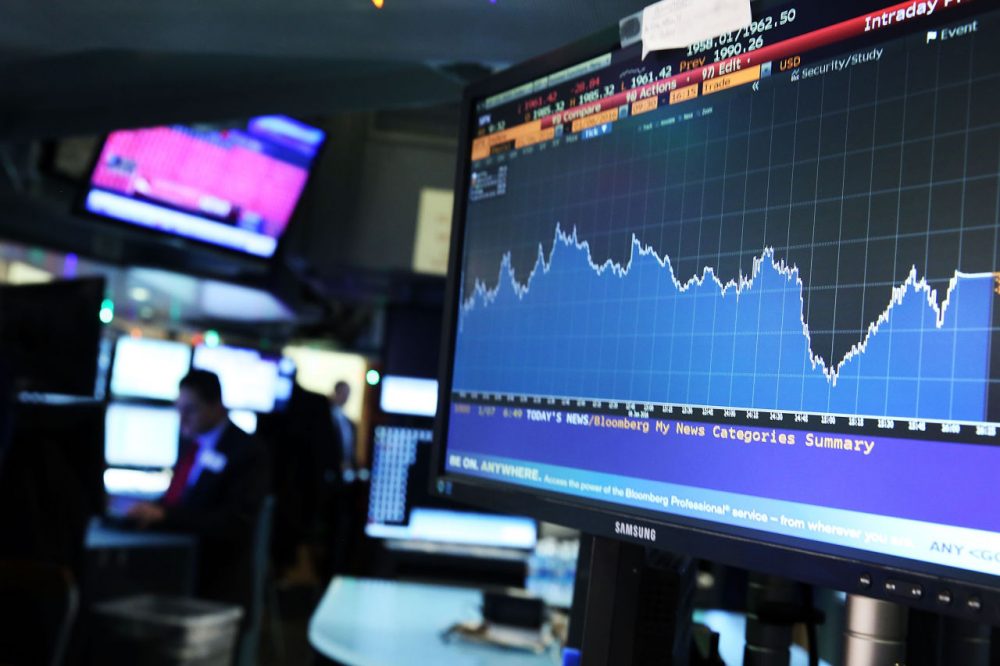 A screen shows the market movements as traders work on the floor of the New York Stock Exchange (NYSE) on January 7, 2016 in New York City. Chinese stocks plunged on Thursday by more than 7 percent causing the Dow to drop over 200 points in morning trading. (Spencer Platt/Getty Images)