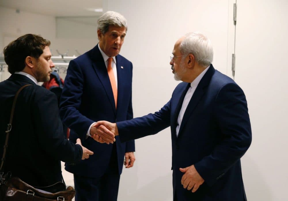 U.S. Secretary of State John Kerry (center) shakes hands with Iranian Foreign Minister Mohammad Javad Zarif (right) after the International Atomic Energy Agency (IAEA) verified that Iran has met all conditions under the nuclear deal during the E3/EU+3 and Iran talks in Vienna on January 16, 2016.
The historic nuclear accord between Iran and major powers entered into force as the UN confirmed that Tehran has shrunk its atomic program and as painful sanctions were lifted on the Islamic republic. (Kevin Lamarque/AFP/Getty Images)