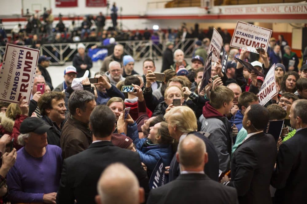 Republican presidential frontrunner Donald Trump takes a selfie with a supporter after he spoke at Stevens High School on January 5, 2016 in Claremont, New Hampshire. The campaign rally filled the school gym with supporters. (Scott Eisen/Getty Images)