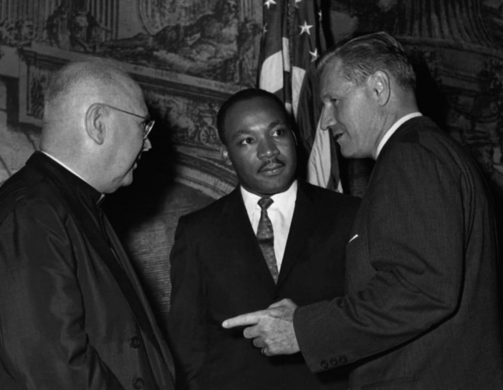 Civil rights leader Dr. Martin Luther King, Jr. talks with Francis Cardinal Spellman, archbishop of New York and Gov. Nelson Rockefeller at a dinner in New York commemorating the centennial of the Emancipation Proclamation in 1962. (AP)