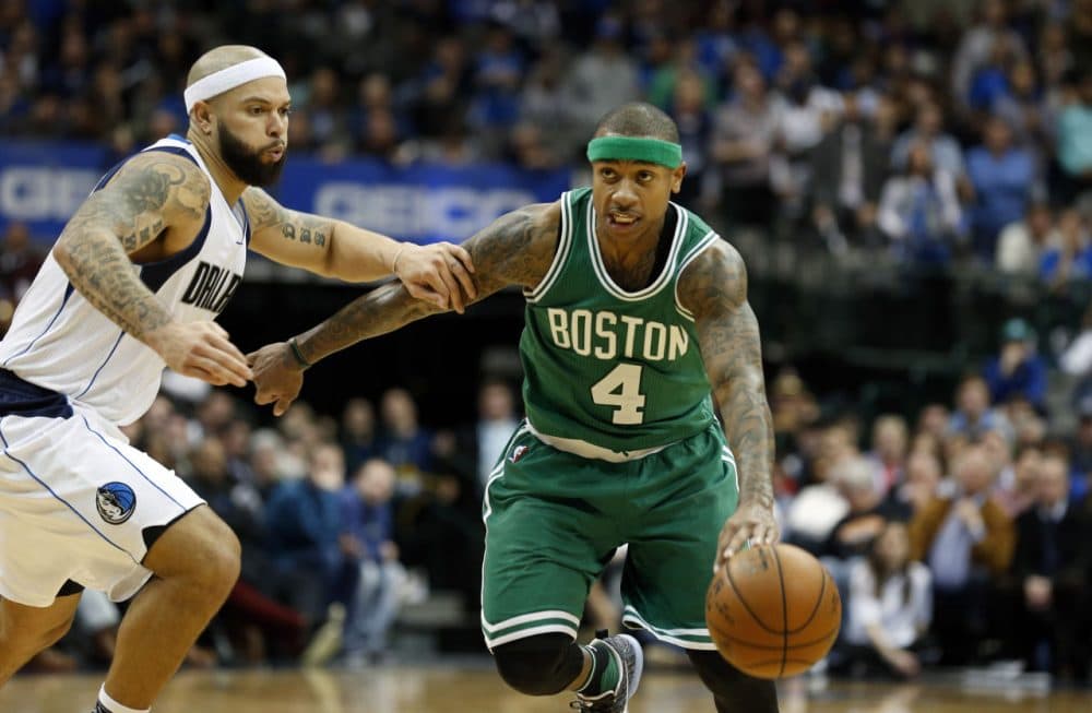 Dallas Mavericks guard Deron Williams defends Boston Celtics guard Isaiah Thomas during overtime of Monday's game in Dallas. (Sharon Ellman/AP)