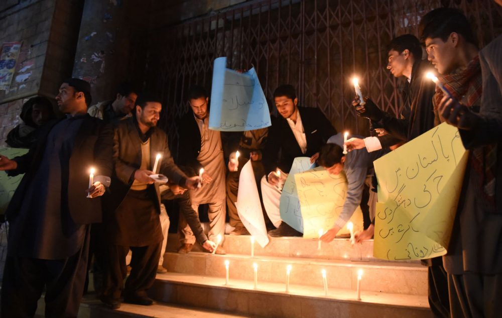 Pakistani students lights candles for victims at Bacha Khan university following an attack, in Quetta on January 20, 2016. At least 21 people died in a Taliban assault on a university in Pakistan, where witnesses reported two large explosions as security forces moved in under dense fog to  halt the bloodshed. (BANARAS KHAN/AFP/Getty Images)