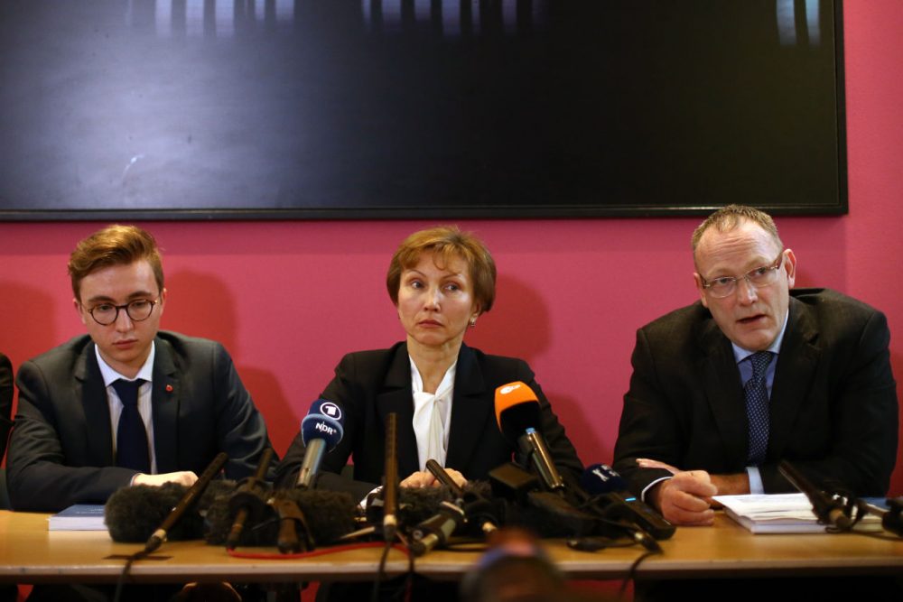 Marina Litvinenko (center) and her son Anatoly (left) listen as their lawyer, Ben Emmerson speaks during a press conference after receiving the results of the inquiry into the death of Marina's husband Alexander Litvinenko, on January 21, 2016 in London, England. Former KGB officer Alexander Litvinenko was poisoned in 2006 with radioactive polonium-210 in the United Kingdom, after fleeing Russia and criticizing president Vladimir Putin. (Carl Court/Getty Images)