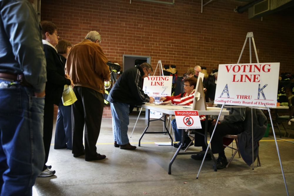 Voters check in to cast their ballots at a fire station that serves as a polling place November 4, 2014 in Climax, North Carolina. (Alex Wong/Getty Images)