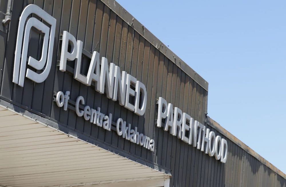 A sign at a Planned Parenthood Clinic is pictured in Oklahoma City, July 24, 2015. The furor on Capitol Hill over Planned Parenthood has stoked a debate about the use of tissue from aborted fetuses in medical research, but U.S. scientists have been using such cells for decades to develop vaccines and seek treatments for a host of ailments, from vision loss and neurological disorders to cancer and AIDS. (Sue Ogrocki/AP)