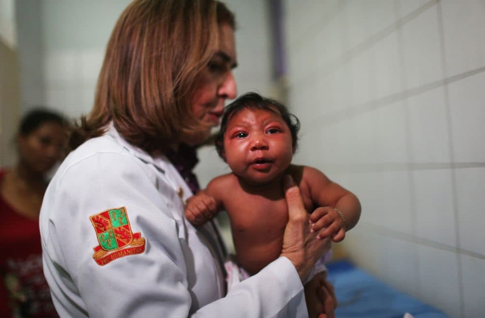 Dr. Angela Rocha, a pediatric infectologist at Oswaldo Cruz Hospital, examines Ludmilla Hadassa Dias de Vasconcelos (2 months), who has microcephaly, on January 26, 2016 in Recife, Brazil. In the last four months, authorities have recorded close to 4,000 cases in Brazil in which the mosquito-borne Zika virus may have led to microcephaly in infants. The ailment results in an abnormally small head in newborns and is associated with various disorders including decreased brain development. According to the World Health Organization (WHO), the Zika virus outbreak is likely to spread throughout nearly all the Americas. At least 12 cases in the United States have now been confirmed by the CDC. Brazil reported the first cases in the Americas of local transmissions of the virus last year. (Mario Tama/Getty Images)