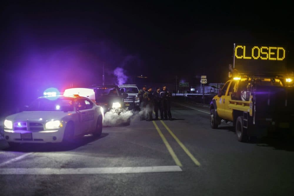 Law enforcement personnel monitor an intersection of closed Highway 395 in Burns, Oregon on January 26, 2016, during a standoff pitting an anti-government militia against the US authorities. One person died in an armed clash with police as they arrested the leaders of a group laying siege to an American wildlife refuge, the FBI said January 26. (ROB KERR/AFP/Getty Images)