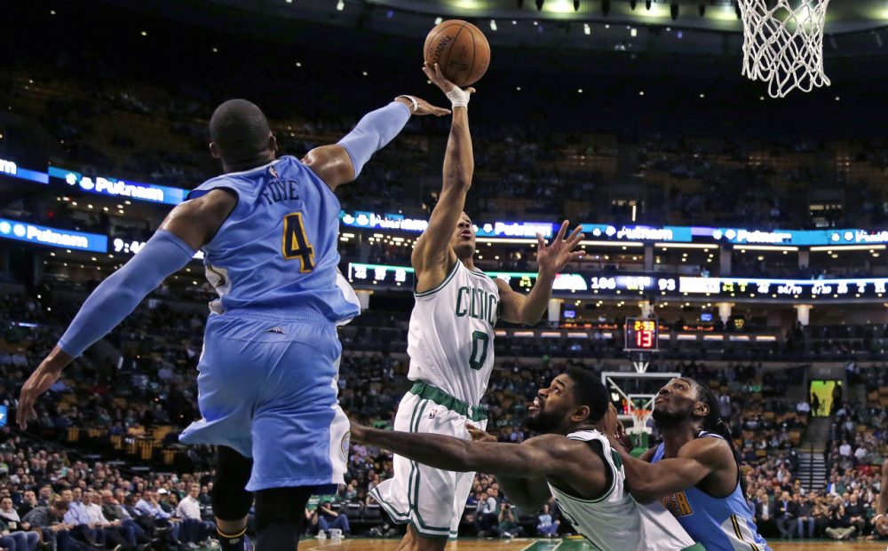 Celtics guard Avery Bradley drives to the basket against Nuggets guard Randy Foye (4). (Charles Krupa/AP)