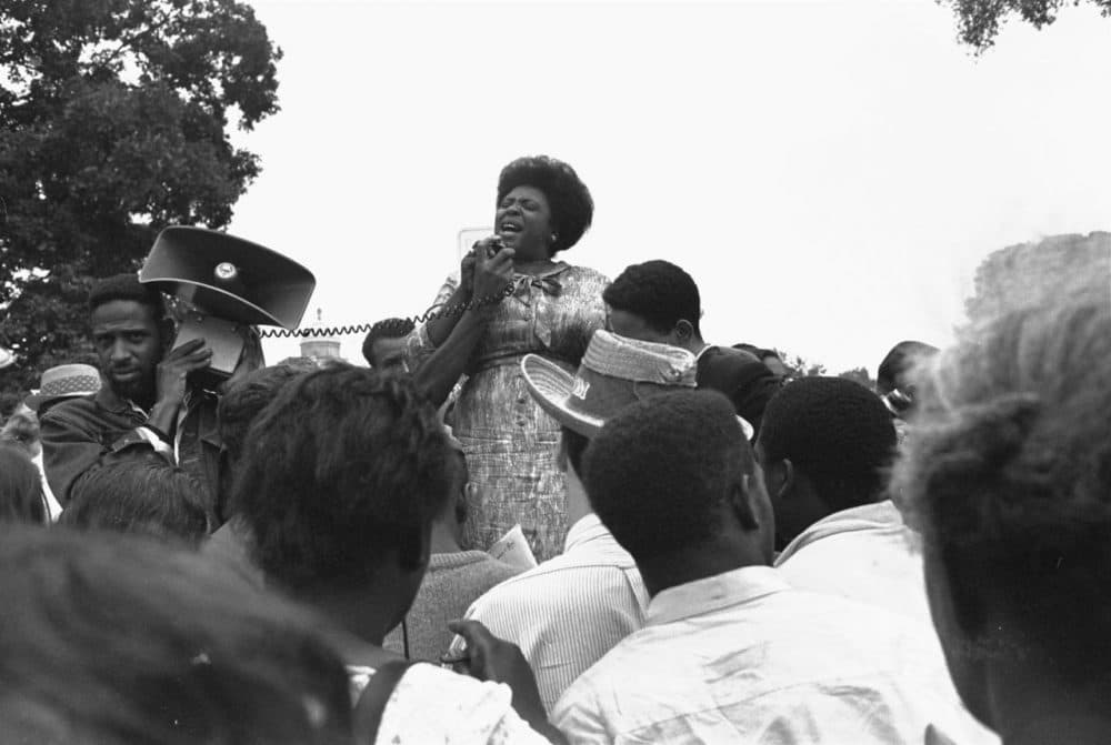 Mrs. Fannie Lou Hamer of Ruleville, Mississippi, speaks to Mississippi Freedom Democratic Party sympathizers outside the Capitol in Washington in 1965. (William J. Smith/AP)