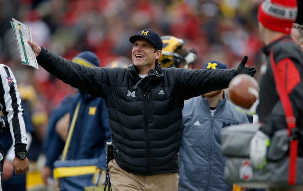 Michigan football Jim Harbaugh is known for the enthusiastic way in which he approaches the game. (Photo by Gregory Shamus/Getty Images)