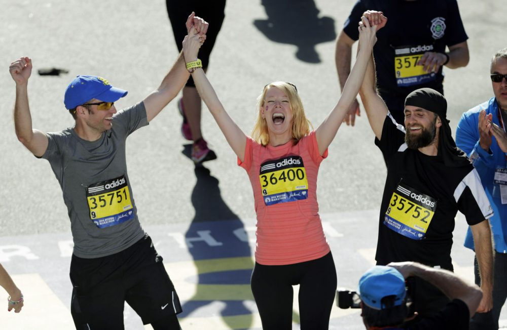 In 2014, during the first running of the marathon after the bombings, Adrianne Haslet-Davis ran the last few blocks of the course with her brothers. (Charles Krupa/AP/File)