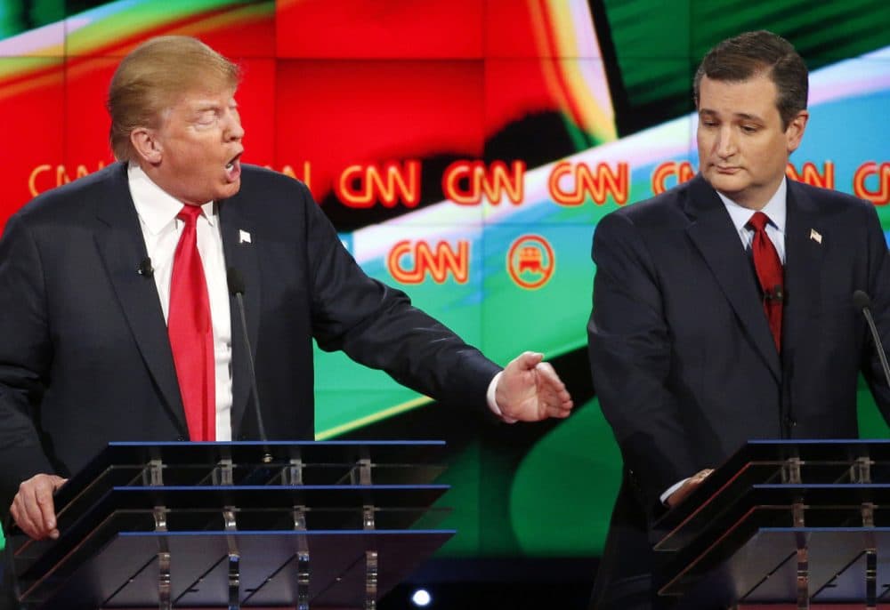 Donald Trump, left, responds forcefully to Jeb Bush (not seen) as Ted Cruz looks on during the CNN Republican presidential debate at the Venetian Hotel &amp; Casino on Tuesday, Dec. 15, 2015, in Las Vegas. (AP Photo/John Locher)
