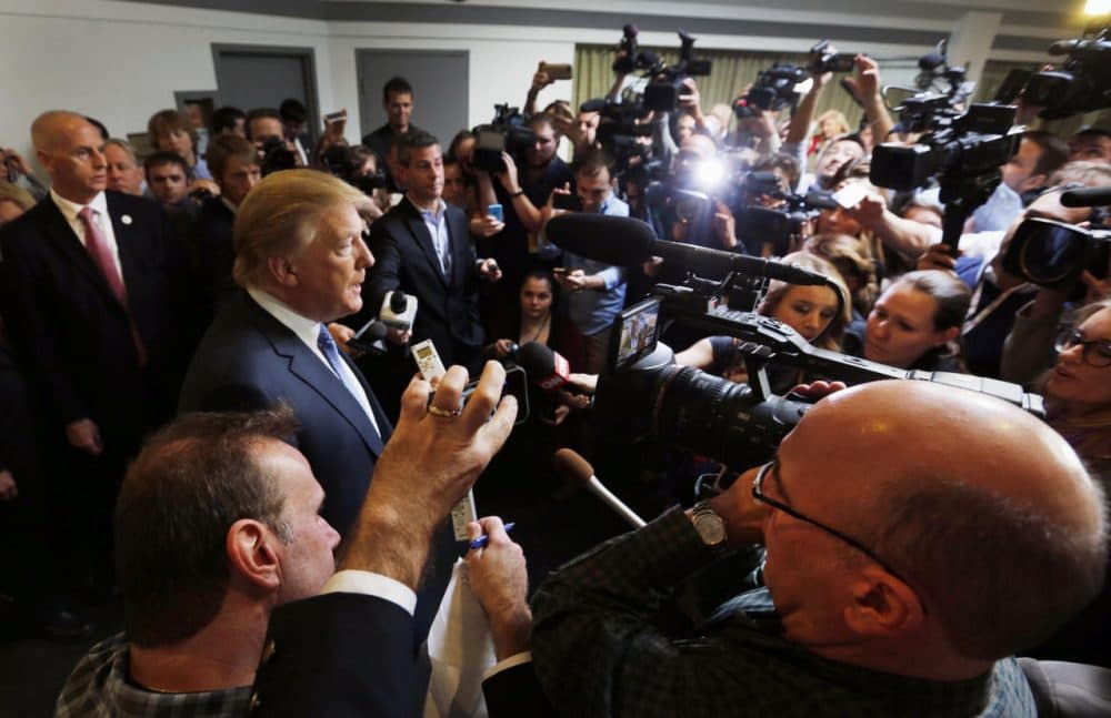 Republican presidential candidate Donald Trump talks with reporters at a campaign event in October 2015. (Jim Cole/AP)